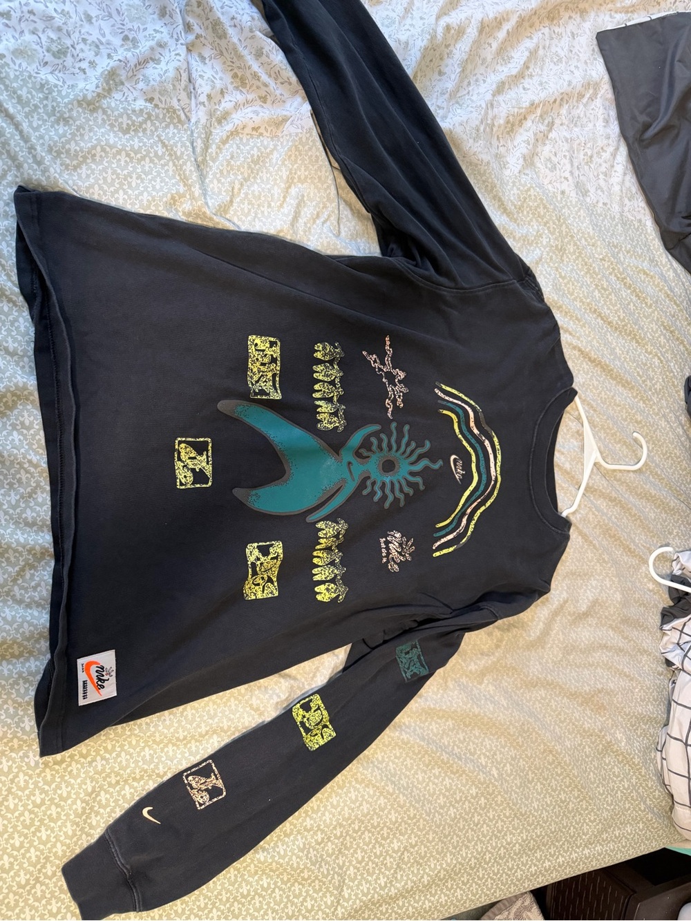 Nike Graphic Black Long Sleeve Tee with Teal Sun Design